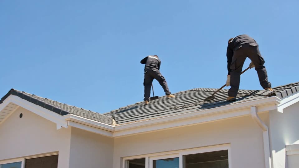 Asbestos Removal Durban - contractors stripping asbestos cement roof sheets from a house roof